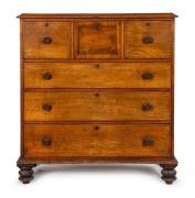An antique Colonial Australian cedar chest of six drawers with cross banded hat drawer, and turned bun feet, New South Wales origin, circa 1855, 131cm high, 122cm wide, 53cm deep