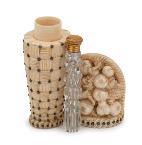 A Georgian carved ivory and cut steel perfume bottle holder with original crystal bottle, early 19th century, 9.5cm high