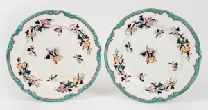 A pair of antique English porcelain plates with floral decoration and turquoise borders, 19th century, 26cm wide