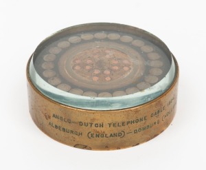 ANGLO-DUTCH TELEPHONE CABLE, 1924: Souvenir paperweight engraved "The First Lead Covered Cable Laid Between England and The Continent.... Siemen's Brothers & Company Limited, London", 3cm high, 7cm wide
