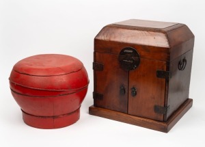 A Chinese red lacquered finish rice box, together with a Chinese elm travelling box fitted with drawers, compartments and mirror, (2 items), the large 38cm high