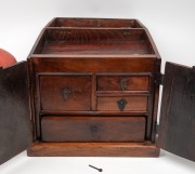 A Chinese red lacquered finish rice box, together with a Chinese elm travelling box fitted with drawers, compartments and mirror, (2 items), the large 38cm high - 2
