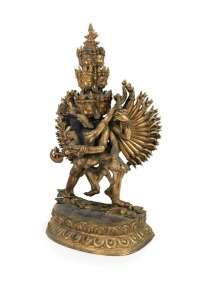 An antique Tibetan bronze deity statue with remains of polychrome and gilt finish, 19th/20th century, 44cm high