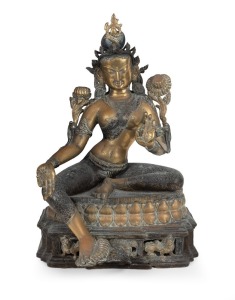 An antique Tibetan bronze seated Tara statue with remains of polychrome finish, 19th/20th century, 43cm high