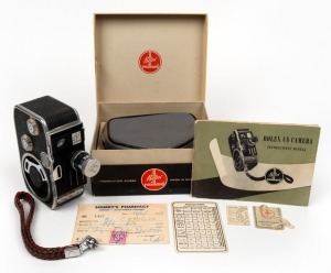 BOLEX-PAILLARD: C8 double-8 movie camera, c. 1954, in maker's box with lens and lens cap, wrist strap, and printed matter.