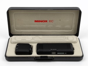 MINOX: Minox&nbsp;EC subminiature camera [#2790690], c. 1981, with 15mm f5.6 lens, in maker's case with FE4 flash cube accessory, chain, battery, and film canister.
