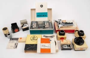 BOLEX-PAILLARD: Twelve accessories, all in maker's boxes, including one Declic Handle, one shutter release, one 8mm Film Splicer, three lens hoods, one parallax corrector, and one filter holder/sunshade, among others. (12 items)