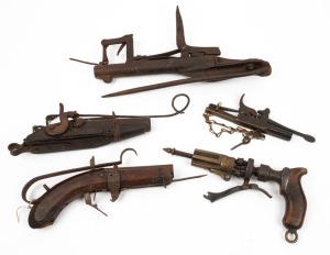 GOFFER GUNS. A group&nbsp;of five antique black powder examples of varying form, including two percussion caps, 19th century, 34cm long