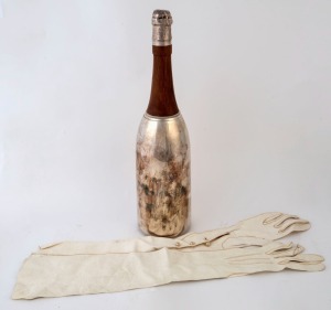 A vintage cocktail shaker in the form of a champagne bottle together with a pair of vintage ladies' kid cocktail evening wear gloves, 20th century 36cm high