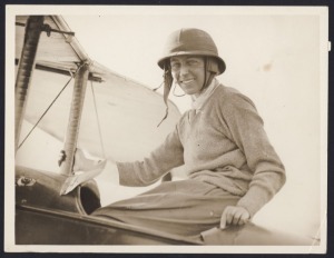 AMY JOHNSON: Five early 1930s press photographs of pioneering aviatrix Amy Johnson, the largest 30.5 x 19cm, including an image of her helmeted and smiling in cockpit of biplane; plus two others. (7 items)