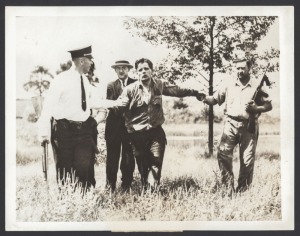 CRIME: Eleven 1940s press agency photographs, featuring reporting on the King David Hotel bombing in Jerusalem, Japanese war crimes tribunals, Dutch policing of Nationalists in Indonesia, kidnappers and bandits in the eastern United States, and others. (1