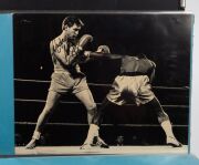 An album containing a collection of signed photographs, cards, postcards and cuttings, with the signatories including Archie Moore, Dado Marino, Sam Ichinose, Freddie Mills, Doug Miller, Rinty Monaghan, Andries Steyn, Manuel Ortiz, Danny O'Sullivan, Jim P - 5