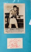 An album containing a collection of signed photographs, cards, postcards and cuttings, with the signatories including Archie Moore, Dado Marino, Sam Ichinose, Freddie Mills, Doug Miller, Rinty Monaghan, Andries Steyn, Manuel Ortiz, Danny O'Sullivan, Jim P - 8
