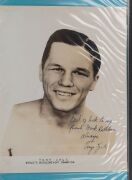 An album containing a collection of signed photographs, cards, postcards and cuttings, with the signatories including Archie Moore, Dado Marino, Sam Ichinose, Freddie Mills, Doug Miller, Rinty Monaghan, Andries Steyn, Manuel Ortiz, Danny O'Sullivan, Jim P - 15