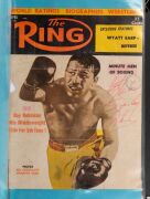 An album containing a collection of signed photographs, cards, postcards and cuttings, with the signatories including Archie Moore, Dado Marino, Sam Ichinose, Freddie Mills, Doug Miller, Rinty Monaghan, Andries Steyn, Manuel Ortiz, Danny O'Sullivan, Jim P - 22