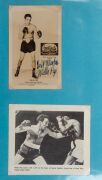 An album containing a collection of signed photographs, cards, postcards and cuttings, with the signatories including Archie Moore, Dado Marino, Sam Ichinose, Freddie Mills, Doug Miller, Rinty Monaghan, Andries Steyn, Manuel Ortiz, Danny O'Sullivan, Jim P - 23