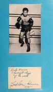 An album containing a collection of signed photographs, cards, postcards and cuttings, with the signatories including Archie Moore, Dado Marino, Sam Ichinose, Freddie Mills, Doug Miller, Rinty Monaghan, Andries Steyn, Manuel Ortiz, Danny O'Sullivan, Jim P - 27