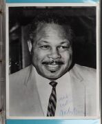 An album containing a collection of signed photographs, cards, postcards and cuttings, with the signatories including Archie Moore, Dado Marino, Sam Ichinose, Freddie Mills, Doug Miller, Rinty Monaghan, Andries Steyn, Manuel Ortiz, Danny O'Sullivan, Jim P - 28