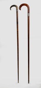 111 · An unusual antique Australian walking stick with carved horn handle, silver collar and segmented leather shaft with brass ferrule; together with a blackwood and myrtle walking stick with silver collar, 19th/20th century, the larger 94cm high