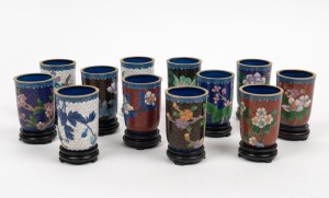 A set of twelve Chinese cloisonne beakers on timber stands, 20th century, 9cm each overall