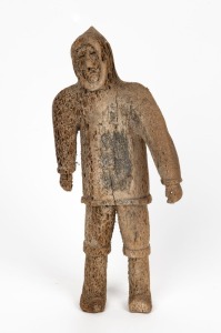 An Inuit carved whalebone statue, 20th century, 33cm high