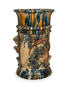 BRUNSWICK POTTERY rare and superb exhibition quality pottery umbrella stand of tree stump form with applied lizards and branches, impressively glazed in mottled blue majolica drip glaze, by JAMES CAMPAIN, 19th century, incised "J.J.C.", 57cm high, 34cm diameter. Featured in "A Guide To Collecting Australiana" by Juliana and Toby Hooper, plate 11, page 83. (errantly described as John Campbell).