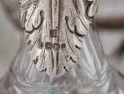 An English Georgian sterling silver nine piece cruet set with Rococo&nbsp;floral border standing on acanthus and shell feet. The cruet bottles of&nbsp;reeded crystal form with conforming acanthus silver mounts. Made by&nbsp;Joseph Angell of London, 26cm high, 27cm wide, - 7
