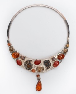 A designer sterling silver choker necklace, encrusted with amber, carnelian, agate and fossils, late 20th century, stamped "925, A.R.", 21cm high overall