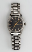 ROLEX "Oyster Precision" manual wind gents stainless steel wristwatch with black dial and baton numerals, later steel bracelet and ownership engraving to the back of the case, 3.8cm wide including crown