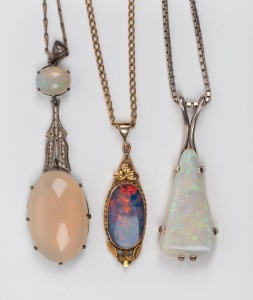 Three assorted opal pendants, mounted in silver and gold plate, all on chains to match.