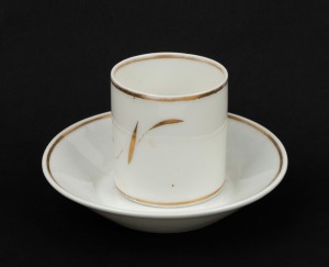 An antique French Napoleonic period porcelain cup and saucer with gilt rim and "N" monogram, (2 items), ​​​​​​​the saucer 13cm diameter