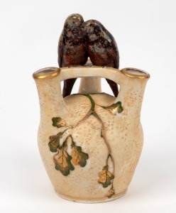 An Austrian Amphora vase with love birds and gilt floral decoration, designed by Ernst Wahliss&nbsp;for Turn Potteries, early 20th century, factory mark to base "Turn, Vienna, Made In Austria", 20cm high.