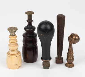 Five assorted antique seals including turned ivory, rosewood and cast bronze claw, 19th century, the largest 10cm high