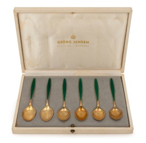 Georg Jensen Denmark, A set of sterling silver gilt teaspoons with green enamel inlaid handles in original&nbsp;Georg Jensen case. 20th CenturyThe case 18cm wide, 13cm deep