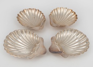 Two pairs of antique English sterling silver scallop shaped condiment dishes, London and Sheffield made, early 20th century, (4 items), ​​​​​​​13.5cm and 12cm wide, 254 grams total