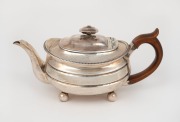 An antique&nbsp;English sterling silver teapot, made by Solomon Hougham of&nbsp;London, circa 1789, 12cm high, 25cm wide, ​​​​​​​508 grams including timber handle