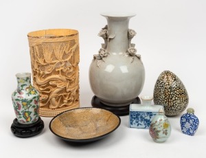 An impressive antique Chinese carved and pierced ivory brush pot (damaged); together with a blanc de chine Chinese porcelain vase, two Chinese porcelain scent bottles, two Chinese porcelain vases, a Vietnamese shell egg ornament and dish, 19th and 20th ce