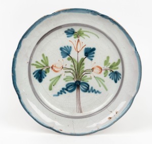 An antique French Faience tin glazed earthenware plate with floral decoration. 18th century23cm diameter