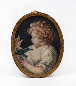 An antique oval miniature portrait of a child with a bird, 19th/20th century, 8 x 6.5cm