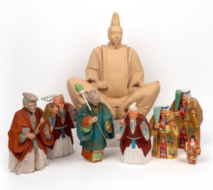 Seven assorted Japanese carved wooden figures; together with a Canadian ceramic seated figure, 20th century, (8 items), the largest 39cm high
