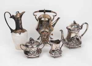 Antique German Art Nouveau silver plated three piece tea service, a W.M.F. German silver plated spirit kettle on stand, and a Continental silver plated claret jug, 19th/20th century, (5 items), the largest 28cm high