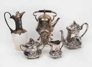 Antique German Art Nouveau silver plated three piece tea service, a W.M.F. German silver plated spirit kettle on stand, and a Continental silver plated claret jug, 19th/20th century, (5 items), ​​​​​​​the largest 28cm high
