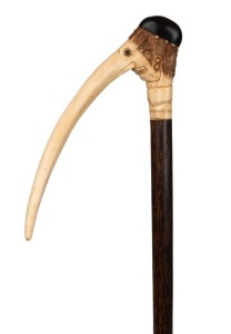 MUENCHNER BILDERBOGEN&nbsp;antique German walking stick with carved deer antler handle, timber shaft and antler ferrule, 19th century, together with a reference book on walking sticks where a similar example is referenced on page 125. (2 items), 96cm high