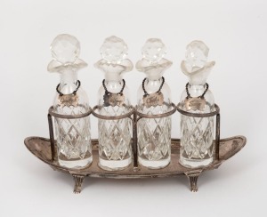 An 18th century sterling silver four bottle condiment cruet set with silver labels, made by Henry Chawner of London, circa 1796, the base 24cm wide, 300+ grams silver weight