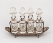 An 18th century sterling silver four bottle condiment cruet set with silver labels, made by Henry Chawner of London, circa 1796,&nbsp; the base 24cm wide, 300+ grams silver weight