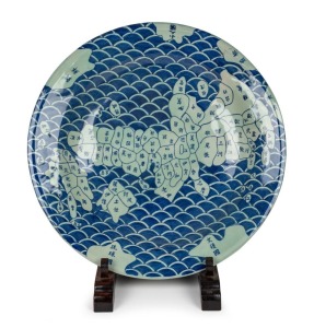 A Japanese celadon and blue porcelain charger depicting a map of old Japan showing the various regions, with adjustable timber stand, 20th century, ​​​​​​​61.5cm diameter