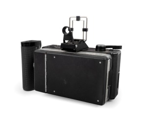 ASANUMA: Unusual King Sequence Eight eight-lens camera [#2912], c. 1980s, with twin lens caps, folding viewfinder, Polaroid film back, and maker's leather case.
