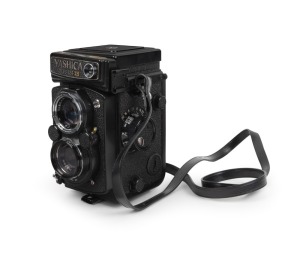 YASHICA: Yashica-Mat 124G TLR camera [#207041], c. 1970, with Yashinon 80mm f3.5 lens, Copal-SV shutter, 1A lens filter, matching leather case, lens cap, lens hood in case, and instruction booklet.