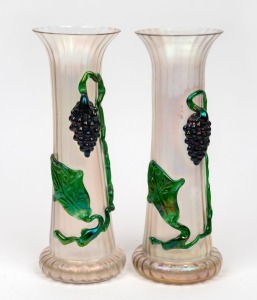 A pair of antique Bohemian iridescent glass mantle vases with applied grape motifs, 19th century, 32cm high