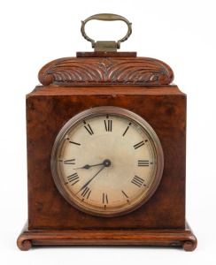 An antique English walnut cased spring table clock with Swiss time only movement and platform escapement. Convex silvered dial with Roman numerals, 20th century, 21cm high.